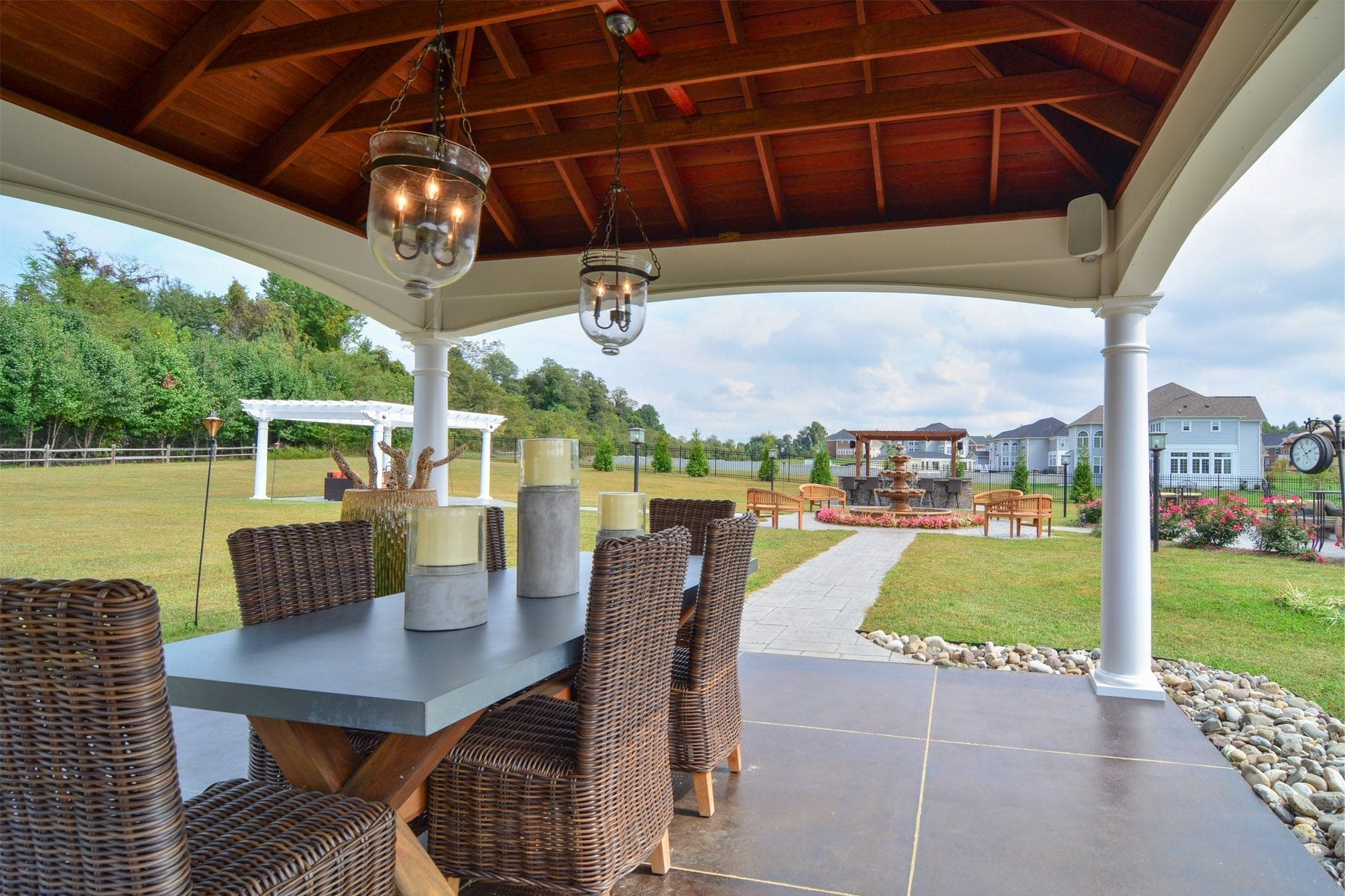 Covered patio with clean wicker furniture