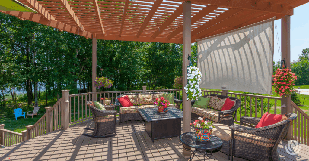 Covered patio area with wood pergola and pavers