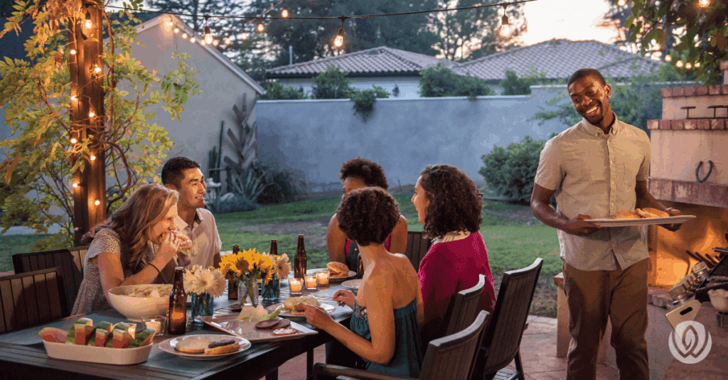 friends enjoying outdoor kitchen