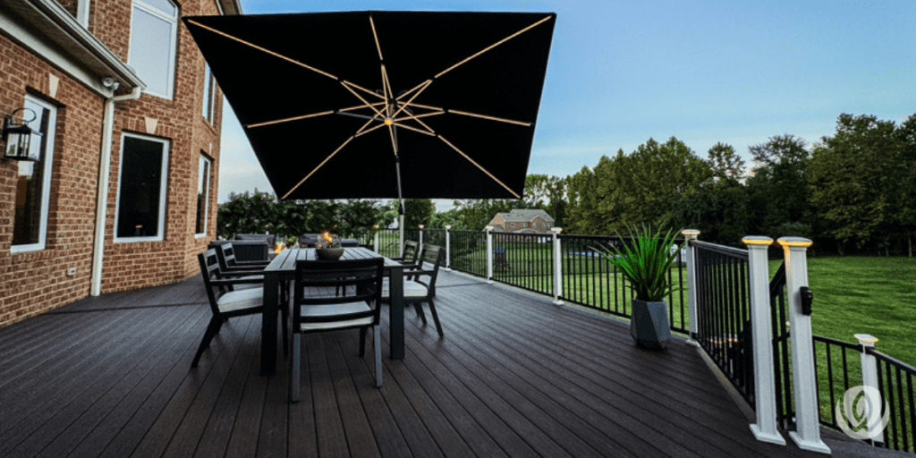 Wooden deck with dining table and large umbrella